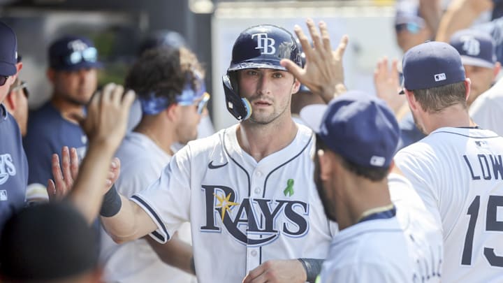 Tampa Bay outfielder Kameron Misner celebrates scoring a run with his teammates during Sunday's 13-0 rout of the Toronto Blue Jays.
