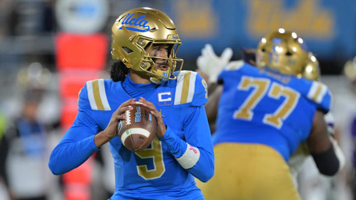 Nov 22, 2025; Pasadena, California, USA;  UCLA Bruins quarterback Nico Iamaleava (9) sets to pass the ball during the first half against the Washington Huskies at the Rose Bowl. Mandatory Credit: Jayne Kamin-Oncea-Imagn Images