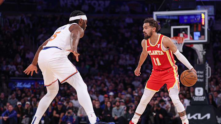 Jan 20, 2025; New York, New York, USA; Atlanta Hawks guard Trae Young (11) is guarded by New York Knicks forward Precious Achiuwa (5) during the second half at Madison Square Garden. Mandatory Credit: Vincent Carchietta-Imagn Images