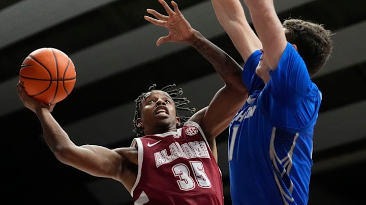 Dec 14, 2024; Tuscaloosa, AL, USA; Alabama forward Derrion Reid (35) goes to the basket against Creighton center Ryan Kalkbrenner (11) at Coleman Coliseum. Alabama defeated Creighton 83-75. Mandatory Credit: Gary Cosby Jr.-Tuscaloosa News Dec 14, 2024; Tuscaloosa, AL, USA; Alabama forward Derrion Reid (35) goes to the basket against Creighton center Ryan Kalkbrenner (11) at Coleman Coliseum. Alabama defeated Creighton 83-75. Mandatory Credit: Gary Cosby Jr.-Tuscaloosa News