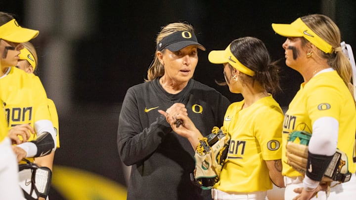 Oregon coach Melyssa Lombardi talks to players as the Oregon Ducks host the UCLA Bruins on April 18, 2025, at Jane Sanders Stadium in Eugene.