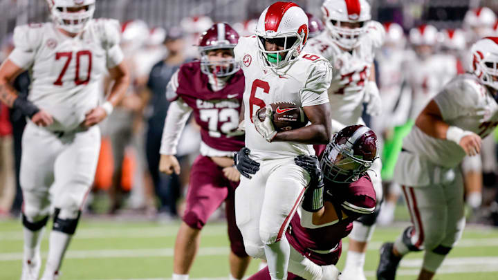 Owasso’s Jayden Hall (6) runs the ball during a high school football game between Edmond Memorial and Owasso in Edmond, Okla. on Thursday, Oct. 17, 2024.