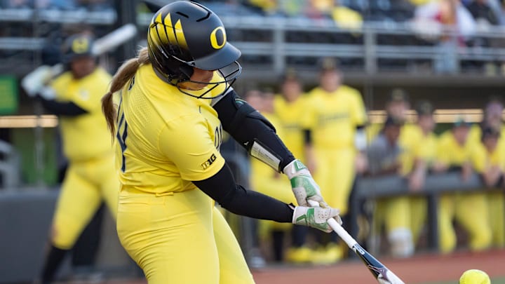 Oregon infielder Rylee McCoy rips a single against San Diego at the Oregon Classic in February.  