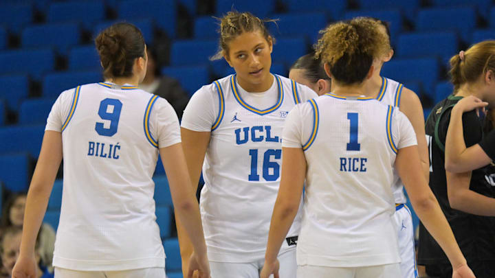 Dec 16, 2025; Los Angeles, California, USA; UCLA Bruins forward Sienna Betts (16) reacts at guard Lena Bilic (9) and guard Kiki Rice (1) after a foul during the second half against the Cal Poly Mustangs at Pauley Pavilion presented by Wescom Financial. Mandatory Credit: Jayne Kamin-Oncea-Imagn Images Dec 16, 2025; Los Angeles, California, USA; UCLA Bruins forward Sienna Betts (16) reacts at guard Lena Bilic (9) and guard Kiki Rice (1) after a foul during the second half against the Cal Poly Mustangs at Pauley Pavilion presented by Wescom Financial. Mandatory Credit: Jayne Kamin-Oncea-Imagn Images