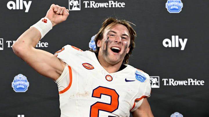 Dec 7, 2024; Charlotte, NC, USA; Clemson Tigers quarterback Cade Klubnik (2) celebrates after winning the 2024 ACC Championship game against the Southern Methodist Mustangs at Bank of America Stadium. Dec 7, 2024; Charlotte, NC, USA; Clemson Tigers quarterback Cade Klubnik (2) celebrates after winning the 2024 ACC Championship game against the Southern Methodist Mustangs at Bank of America Stadium.