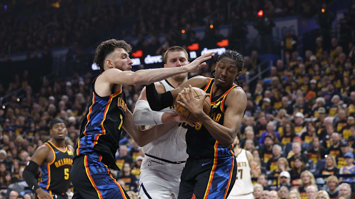 May 5, 2025; Oklahoma City, Oklahoma, USA; Oklahoma City Thunder forward Jalen Williams (8) and forward Chet Holmgren (7) steal the ball from Denver Nuggets center Nikola Jokic (15) during the second quarter during game one of the second round for the 2025 NBA Playoffs at Paycom Center. Mandatory Credit: Alonzo Adams-Imagn Images May 5, 2025; Oklahoma City, Oklahoma, USA; Oklahoma City Thunder forward Jalen Williams (8) and forward Chet Holmgren (7) steal the ball from Denver Nuggets center Nikola Jokic (15) during the second quarter during game one of the second round for the 2025 NBA Playoffs at Paycom Center. Mandatory Credit: Alonzo Adams-Imagn Images