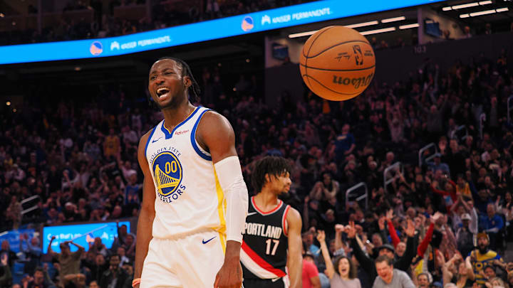 Dec 6, 2023; San Francisco, California, USA; Golden State Warriors forward Jonathan Kuminga (00) reacts after a dunk against the Portland Trail Blazers during the fourth quarter at Chase Center. Mandatory Credit: Kelley L Cox-Imagn Images