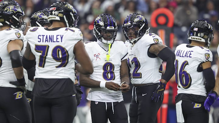 Dec 25, 2024; Houston, Texas, USA;  Baltimore Ravens quarterback Lamar Jackson (8) and running back Derrick Henry (22) before a play during the game against the Houston Texans at NRG Stadium. Mandatory Credit: Troy Taormina-Imagn Images