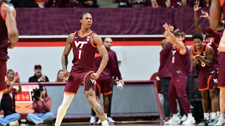 Feb 15, 2025; Blacksburg, Virginia, USA;  Virginia Tech Hokies forward Tobi Lawal (1) celebrates after a shot during the first half against the Virginia Cavaliers at Cassell Coliseum. Mandatory Credit: Brian Bishop-Imagn Images