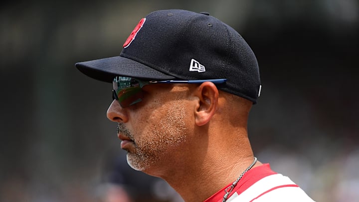 Jul 14, 2024; Boston, Massachusetts, USA;  Boston Red Sox manager Alex Cora watches from the dugout during the third inning against the Kansas City Royals at Fenway Park. Mandatory Credit: Bob DeChiara-Imagn Images