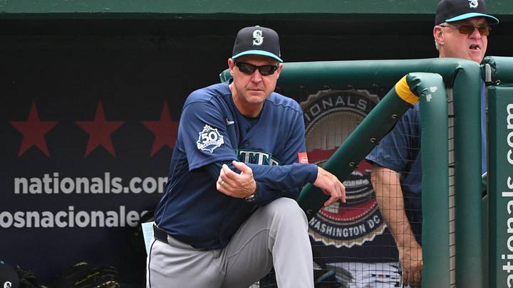 Jun 14, 2026; Washington, District of Columbia, USA; Seattle Mariners manager Dan Wilson (6) watches from the dugout against the Washington Nationals during the fifth inning at Nationals Park. Mandatory Credit: Rafael Suanes-Imagn Images