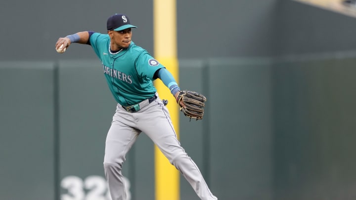 Seattle Mariners second baseman Jorge Polanco (7) throws the ball to first base for an out against the Minnesota Twins in the first inning at Target Field. 
