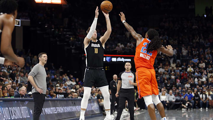 Mar 16, 2024; Memphis, Tennessee, USA; Memphis Grizzlies guard Luke Kennard (10) shoots for three as
