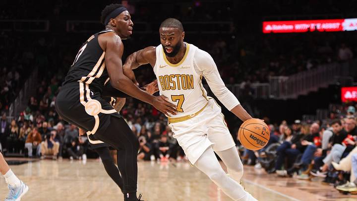 Jan 17, 2026; Atlanta, Georgia, USA; Boston Celtics guard Jaylen Brown (7) drives on Atlanta Hawks forward Onyeka Okongwu (17) in the third quarter at State Farm Arena. Mandatory Credit: Brett Davis-Imagn Images