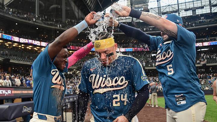 Aug 21, 2026; Milwaukee, Wisconsin, USA;  Milwaukee Brewers left fielder Luis Lara (18) and center fielder Garrett Mitchell (5) pours water on catcher William Contreras (24) after beating the Atlanta Braves at American Family Field.  Mandatory Credit: Benny Sieu-Imagn Images