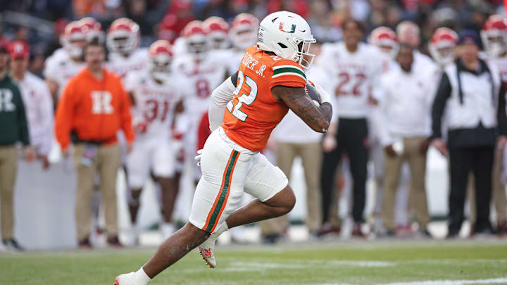 Dec 28, 2023; Bronx, NY, USA; Miami Hurricanes running back Mark Fletcher Jr. (22) carries the ball during the first half of the 2023 Pinstripe Bowl against the Rutgers Scarlet Knights at Yankee Stadium. Mandatory Credit: Vincent Carchietta-USA TODAY Sports