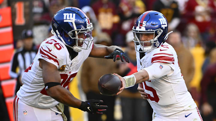 Nov 19, 2023; Landover, Maryland, USA; New York Giants quarterback Tommy DeVito (15) hands off to