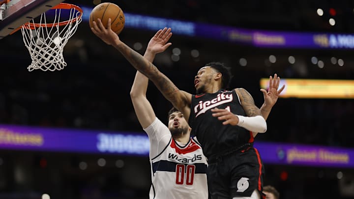 Feb 26, 2025; Washington, District of Columbia, USA; Portland Trail Blazers guard Anfernee Simons (1) shoots the ball as Washington Wizards forward Tristan Vukcevic (00) defends in the first half at Capital One Arena. Mandatory Credit: Geoff Burke-Imagn Images Feb 26, 2025; Washington, District of Columbia, USA; Portland Trail Blazers guard Anfernee Simons (1) shoots the ball as Washington Wizards forward Tristan Vukcevic (00) defends in the first half at Capital One Arena. Mandatory Credit: Geoff Burke-Imagn Images