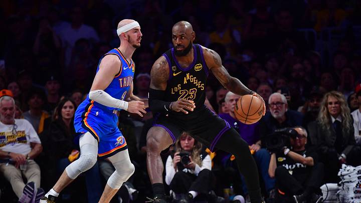 May 11, 2026; Los Angeles, California, USA; Los Angeles Lakers forward LeBron James (23) moves the ball against Oklahoma City Thunder guard Alex Caruso (9) during the second half in game four of the second round of the 2026 NBA Playoffs at Crypto.com Arena. Mandatory Credit: Gary A. Vasquez-Imagn Images