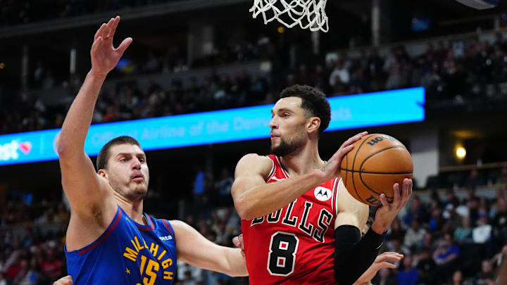 Nov 4, 2023; Denver, Colorado, USA; Denver Nuggets center Nikola Jokic (15) defends on Chicago Bulls guard Zach LaVine (8) in the second quarter at Ball Arena. Mandatory Credit: Ron Chenoy-Imagn Images