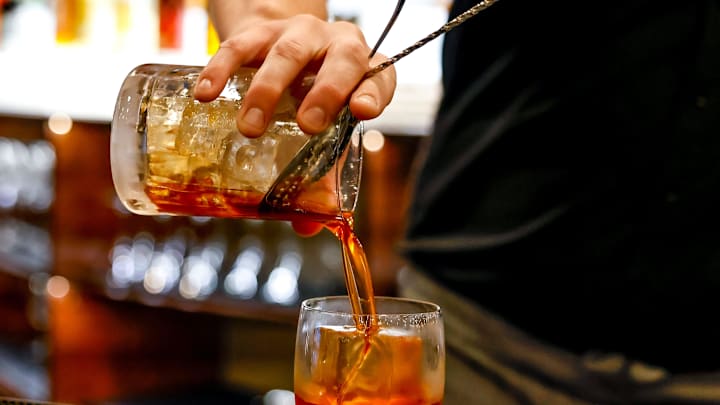 Austin Greer prepares an Old Fashion at new restaurant Symmetry in Oklahoma City, on Thursday, Nov.