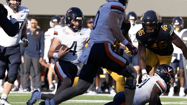 Nov 1, 2025; Berkeley, California, USA; Virginia Cavaliers quarterback Chandler Morris (4) carries the ball on a quarterback keeper against the California Golden Bears during the fourth quarter at California Memorial Stadium. Mandatory Credit: D. Ross Cameron-Imagn Images