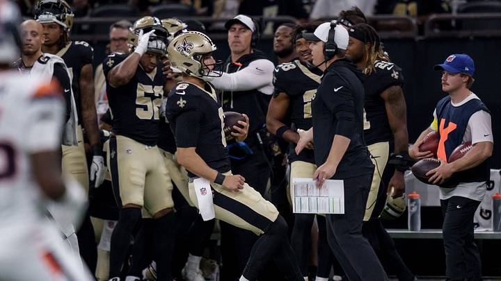 Aug 23, 2025; New Orleans, Louisiana, USA; New Orleans Saints quarterback Tyler Shough (6) runs out of bounds next to New Orleans Saints head coach Kellen Moore against the Denver Broncos during the first half at Caesars Superdome. Mandatory Credit: Matthew Hinton-Imagn Images Aug 23, 2025; New Orleans, Louisiana, USA; New Orleans Saints quarterback Tyler Shough (6) runs out of bounds next to New Orleans Saints head coach Kellen Moore against the Denver Broncos during the first half at Caesars Superdome. Mandatory Credit: Matthew Hinton-Imagn Images
