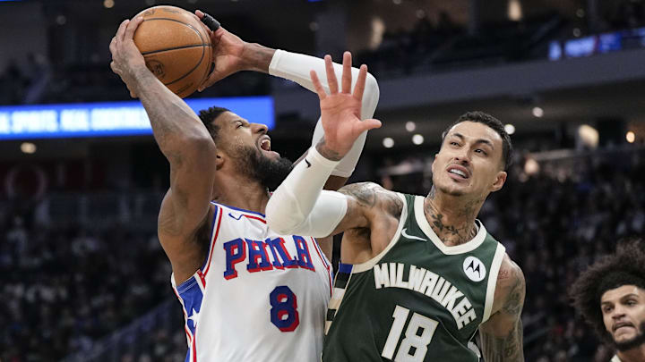 Feb 9, 2025; Milwaukee, Wisconsin, USA; Philadelphia 76ers forward Paul George (8) shoots against Milwaukee Bucks forward Kyle Kuzma (18) during the second quarter at Fiserv Forum. Mandatory Credit: Jeff Hanisch-Imagn Images Feb 9, 2025; Milwaukee, Wisconsin, USA; Philadelphia 76ers forward Paul George (8) shoots against Milwaukee Bucks forward Kyle Kuzma (18) during the second quarter at Fiserv Forum. Mandatory Credit: Jeff Hanisch-Imagn Images