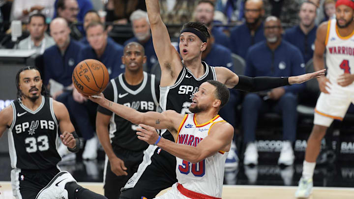 Nov 23, 2024; San Antonio, Texas, USA;  Golden State Warriors guard Stephen Curry (30) shoots under the arm of San Antonio Spurs forward Zach Collins (23) in the second half at Frost Bank Center. Mandatory Credit: Daniel Dunn-Imagn Images