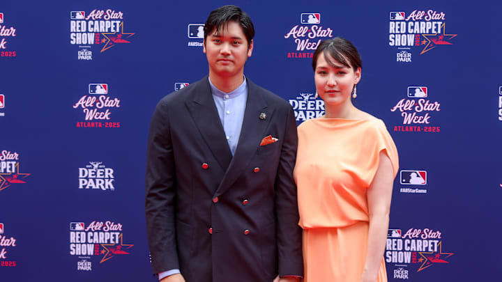 National League designated hitter Shohei Ohtani (17) of the Los Angeles Dodgers and wife Mamiko Tanaka pose for a photo on the red carpet before the 2025 MLB All Star Game at Truist Park. 