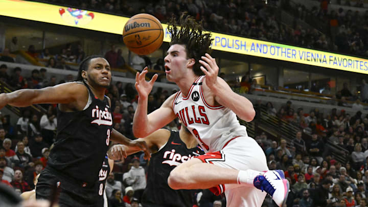 Apr 4, 2025; Chicago, Illinois, USA; Chicago Bulls guard Josh Giddey (3) has the ball broken up by Portland Trail Blazers forward Jabari Walker (34) during the second half at the United Center. Mandatory Credit: Matt Marton-Imagn Images