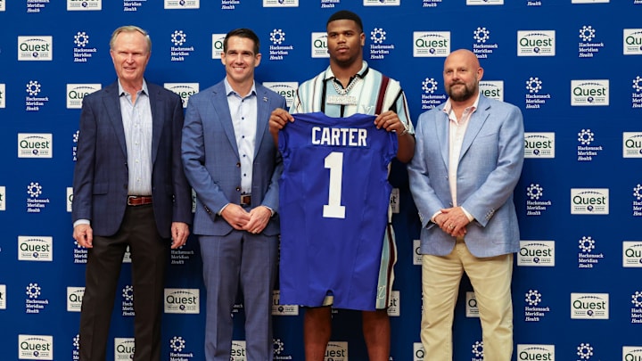Apr 25, 2025; East Rutherford, NJ, US; New York Giants president John Mara (far left), general manager Joe Schoen (left), Abdul Carter, and head coach Brian Daboll (right) pose for photos prior to the start of the press conference to introduce the Giants first round draft picks.  Mandatory Credit: Thomas Salus-Imagn Images
