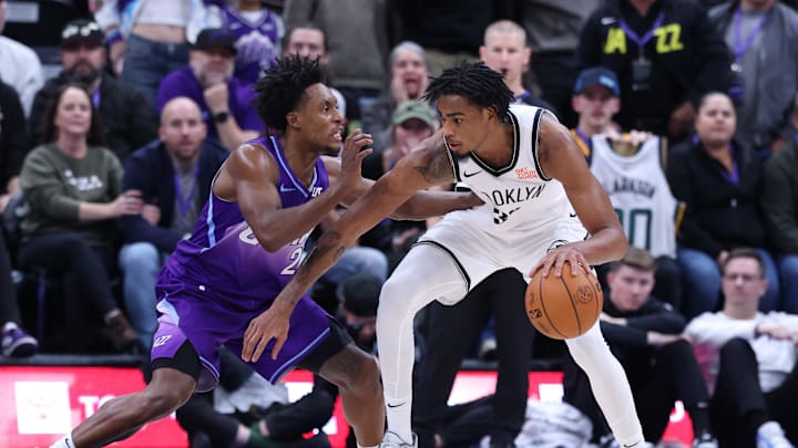 Jan 12, 2025; Salt Lake City, Utah, USA; Brooklyn Nets center Nic Claxton (33) dribbles against Utah Jazz guard Collin Sexton (2) during overtime at Delta Center. Mandatory Credit: Rob Gray-Imagn Images Jan 12, 2025; Salt Lake City, Utah, USA; Brooklyn Nets center Nic Claxton (33) dribbles against Utah Jazz guard Collin Sexton (2) during overtime at Delta Center. Mandatory Credit: Rob Gray-Imagn Images