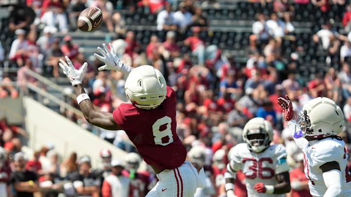 April 11, 2026; Tuscaloosa, AL, USA; Alabama Crimson Tide wide receiver Cederian Morgan (8) catches a deep pass from Alabama Crimson Tide quarterback Keelon Russell (12) at Bryant-Denny Stadium during the Alabama A Day scrimmage.