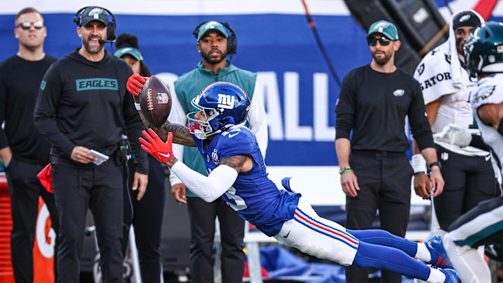 Oct 20, 2024; East Rutherford, New Jersey, USA; New York Giants wide receiver Jalin Hyatt (13) attempts to catch a pass in front of Philadelphia Eagles safety Tristin McCollum (36) during the second half at MetLife Stadium.  
