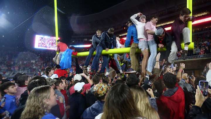 Ole Miss fans tear down the goal posts after the Rebels' win over Georgia.