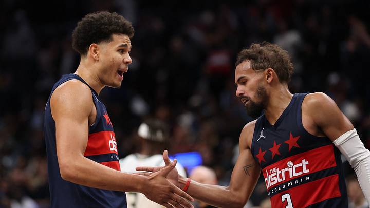 Oct 21, 2026; Washington, District of Columbia, USA; Washington Wizards forward Kyshawn George (18) celebrates with Wizards guard Trae Young (3) during a stoppage in play against the Milwaukee Bucks in the fourth quarter at Capital One Arena. Mandatory Credit: Geoff Burke-Imagn Images Oct 21, 2026; Washington, District of Columbia, USA; Washington Wizards forward Kyshawn George (18) celebrates with Wizards guard Trae Young (3) during a stoppage in play against the Milwaukee Bucks in the fourth quarter at Capital One Arena. Mandatory Credit: Geoff Burke-Imagn Images