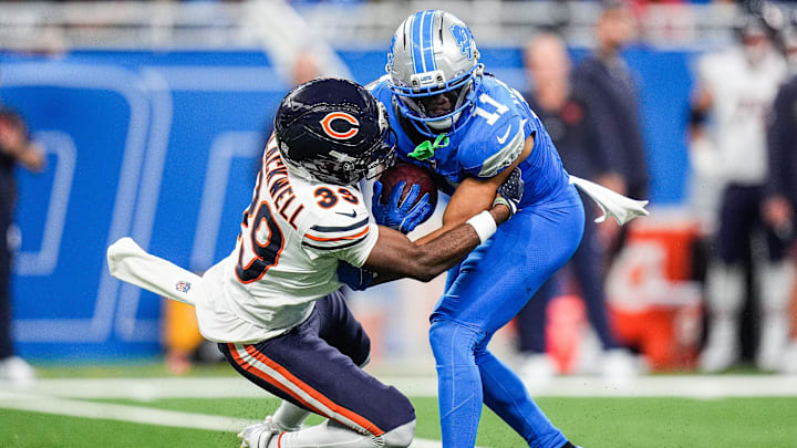 Chicago Bears cornerback Josh Blackwell (39) tackles Detroit Lions punt returner Kalif Raymond during the second half at Ford Field in Detroit on Sunday, Sept. 14, 2025.