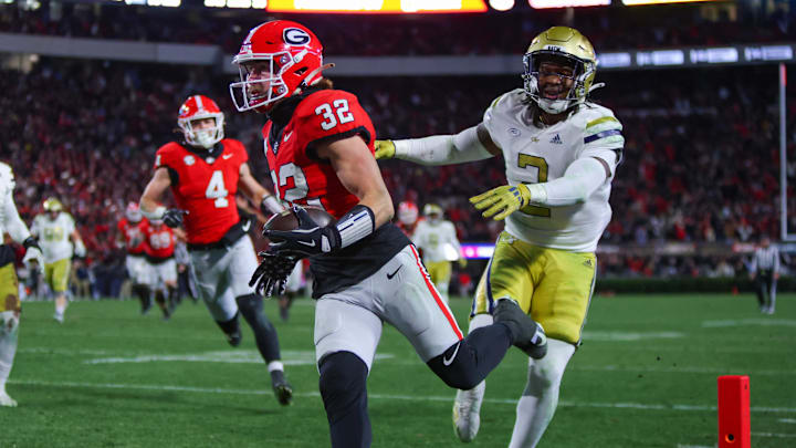Nov 29, 2024; Athens, Georgia, USA; Georgia Bulldogs running back Cash Jones (32) scores against the Georgia Tech Yellow Jackets in overtime at Sanford Stadium. Mandatory Credit: Brett Davis-Imagn Images