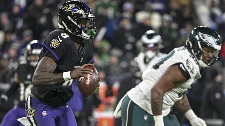 Dec 1, 2024; Baltimore, Maryland, USA; Baltimore Ravens quarterback Lamar Jackson (8) looks to throw as Philadelphia Eagles defensive tackle Jalen Carter (98) applies pressure during the game at M&T Bank Stadium. Mandatory Credit: Tommy Gilligan-Imagn Images Dec 1, 2024; Baltimore, Maryland, USA; Baltimore Ravens quarterback Lamar Jackson (8) looks to throw as Philadelphia Eagles defensive tackle Jalen Carter (98) applies pressure during the game at M&T Bank Stadium. Mandatory Credit: Tommy Gilligan-Imagn Images