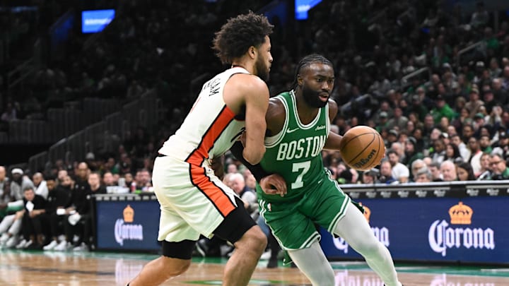 Dec 4, 2024; Boston, Massachusetts, USA; Boston Celtics guard Jaylen Brown (7) drives to the basket against Detroit Pistons guard Cade Cunningham (2) during the fourth quarter at the TD Garden. Mandatory Credit: Brian Fluharty-Imagn Images