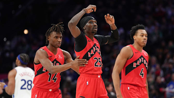 Feb 11, 2025; Philadelphia, Pennsylvania, USA; Toronto Raptors forward Chris Boucher (25) reacts with guard Ja'Kobe Walter (14) against the Philadelphia 76ers in the third quarter at Wells Fargo Center. Mandatory Credit: Kyle Ross-Imagn Images