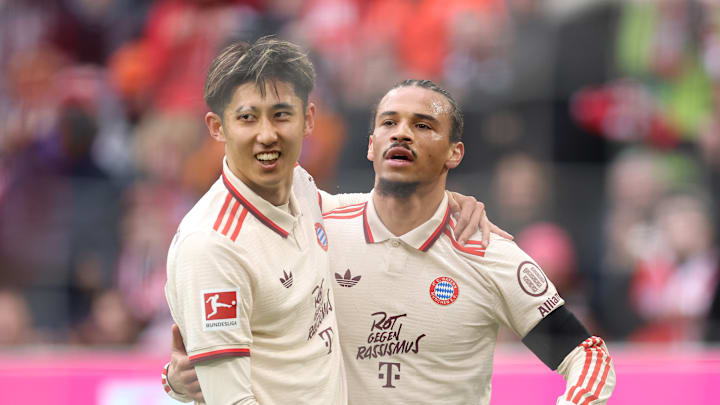 Bayern Munich stars Hiroki Ito and Leroy Sane celebrating a goal against St. Pauli.