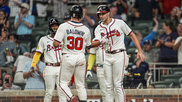 Aug 7, 2025; Cumberland, Georgia, USA; Atlanta Braves catcher Drake Baldwin (30) reacts with first baseman Matt Olson (28) after hitting a three run home run against the Miami Marlins during the eighth inning at Truist Park. Mandatory Credit: Dale Zanine-Imagn Images Aug 7, 2025; Cumberland, Georgia, USA; Atlanta Braves catcher Drake Baldwin (30) reacts with first baseman Matt Olson (28) after hitting a three run home run against the Miami Marlins during the eighth inning at Truist Park. Mandatory Credit: Dale Zanine-Imagn Images