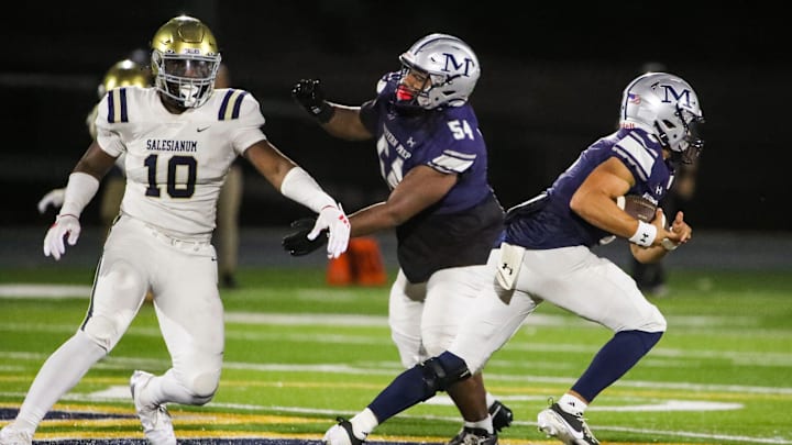 Salesianum's R.J. Johnson can't stop Malvern Prep quarterback Skyler Smith as Smith takes a keeper past offensive lineman Brian Johnson in the second half of Malvern Prep's 27-3 win over Salesianum at Abessinio Stadium, Friday, Sept. 20, 2024.
