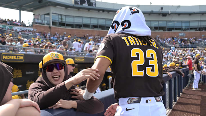 Feb 23, 2026; Peoria, Arizona, USA;  San Diego Padres third baseman Sung-Mun Song (24) and San Diego Padres right fielder Fernando Tatis Jr. (23) share a laugh in the dugout during the game against the Milwaukee Brewers at Peoria Sports Complex. Mandatory Credit: Jayne Kamin-Oncea-Imagn Images