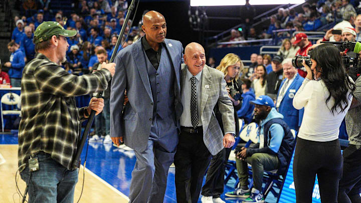 Charles Barkley helps Dick Vitale to their courtside seats for announcing duties before the Indiana Hoosiers and Kentucky Wildcats play college basketball at Rupp Arena in Lexington, Kentucky December 13, 2025.