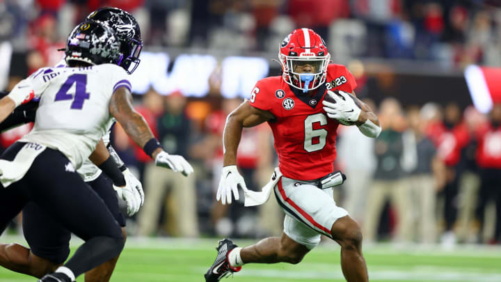 Jan 9, 2023; Inglewood, CA, USA; Georgia Bulldogs running back Kenny McIntosh (6) runs with the ball against the TCU Horned Frogs during the second quarter of the CFP national championship game at SoFi Stadium. Mandatory Credit: Mark J. Rebilas-USA TODAY Sports
