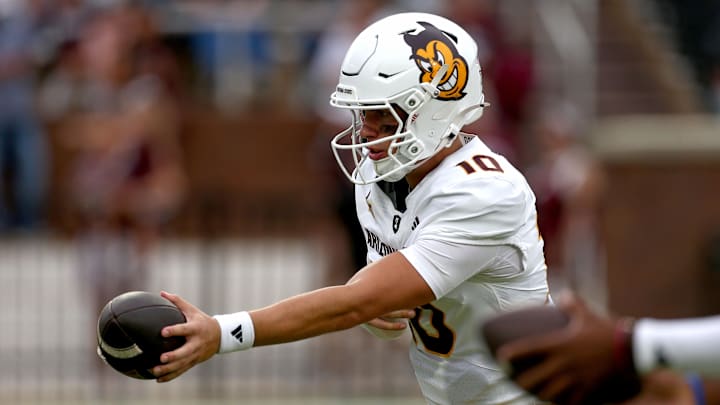 Sep 6, 2025; Starkville, Mississippi, USA; Arizona State Sun Devils quarterback Sam Leavitt (10) hands the ball off during warm ups prior to the game against the Mississippi State Bulldogs at Davis Wade Stadium at Scott Field. Mandatory Credit: Petre Thomas-Imagn Images