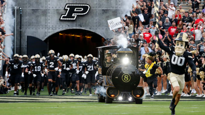 The Purdue Boilermakers make their way to the field The Purdue Boilermakers make their way to the field